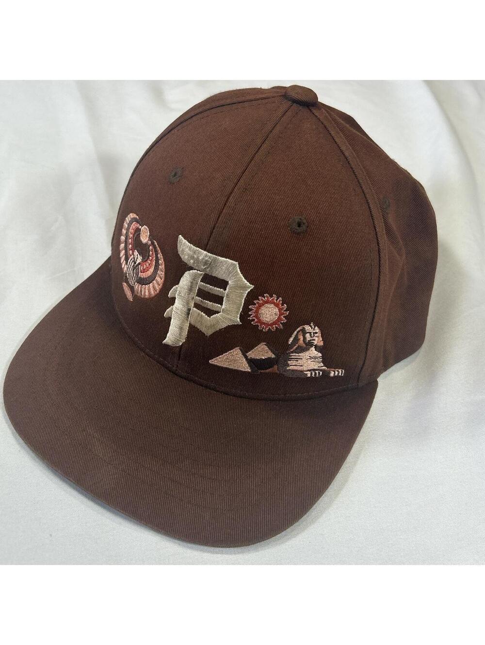 Primitive Passage Brown Egyptian Embroidered Snapback Hat.